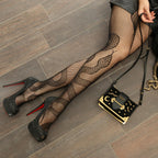 Leg Avenue Snake Net Tights. Black Color